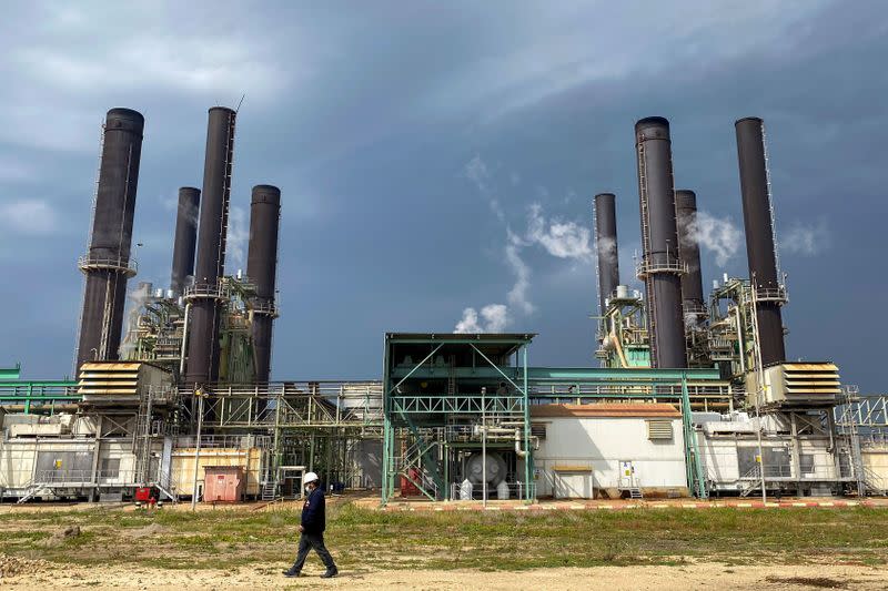 A member of the staff walks at Gaza's lone power plant, in the central Gaza Strip