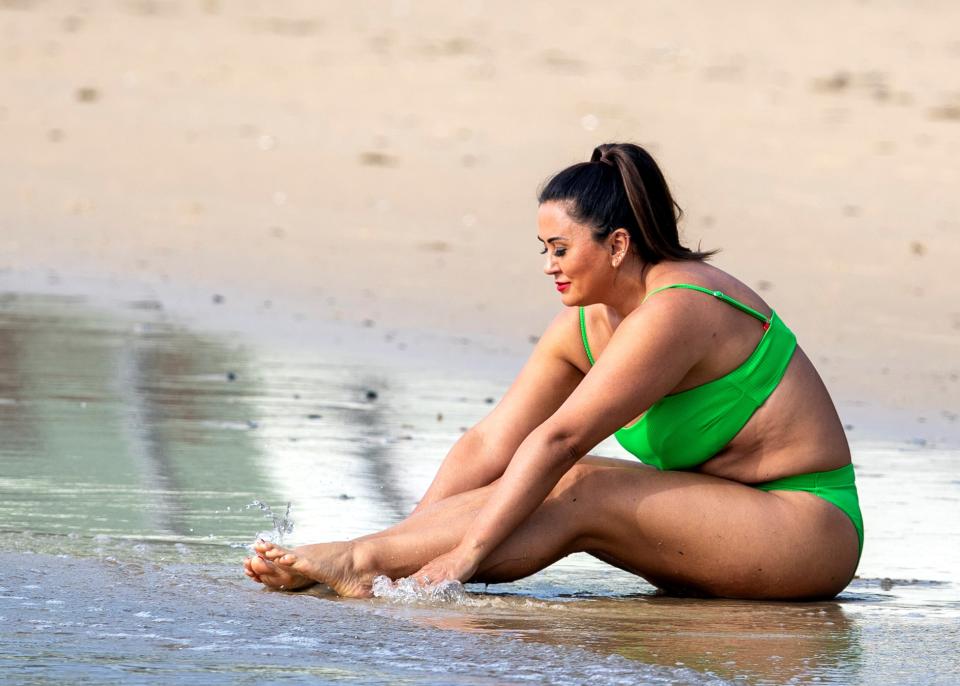 MAFS bride Mishel Meshes cools off in the Sydney heat by taking a dip in a lime green bikini. Photo: DIIMEX.