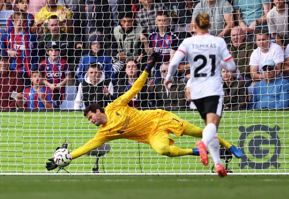 Alisson saved from Sarr before half-time (Reuters)