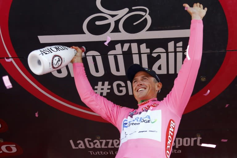 Australian cycist Simon Gerrans of Orica-GreenEdge cycling team wears the leader's pink jersey after winning the first stage of the Giro d'Italia, a 17,6 km team time trial race from San Lorenzo al Mare to San Remo, in San Remo on May 9, 2015