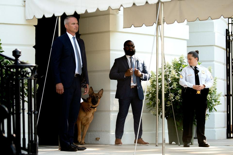 Commander watches as President Joe Biden boards Marine One on the South Lawn of the White House on June 25, 2022.