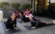 Yoga instructor Rachel Jackson (left) leads a free yoga session for voters outside a polling station in LA. Photo: AP