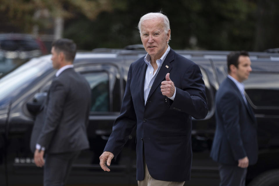 FILE - President Joe Biden responds to a question from a journalist as he leaves St. Edmond's Roman Catholic Church in Rehoboth Beach, Del., after attending Mass, Saturday, Nov. 4, 2023. Public opinions in 24 countries, mostly rich nations, have grown more favorable of the United States than of China, according to the latest survey by the Washington-based Pew Research Center. The gap in favorability of the world's two largest economies widened after views of the U.S. rebounded since President Joe Biden took office in 2021, the report found. (AP Photo/Manuel Balce Ceneta, File)