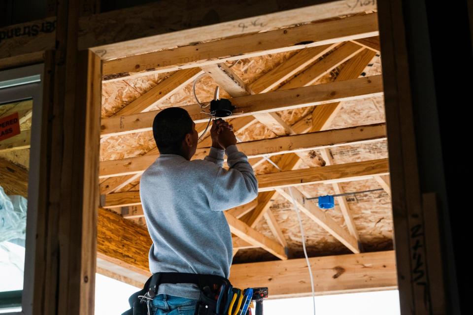 <span>A house under construction in Kyle, Texas, on 18 March 2024.</span><span>Photograph: Jordan Vonderhaar/Bloomberg via Getty Images</span>