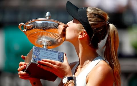 Elina Svitolina of Ukraine kisses the trophy in celebration after the Women's Singles - Credit: Getty