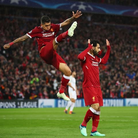 Roberto Firmino, left, and Mohamed Salah scored two each as Liverpool raced to a five-goal lead - Credit: Clive Brunskill/Getty Images