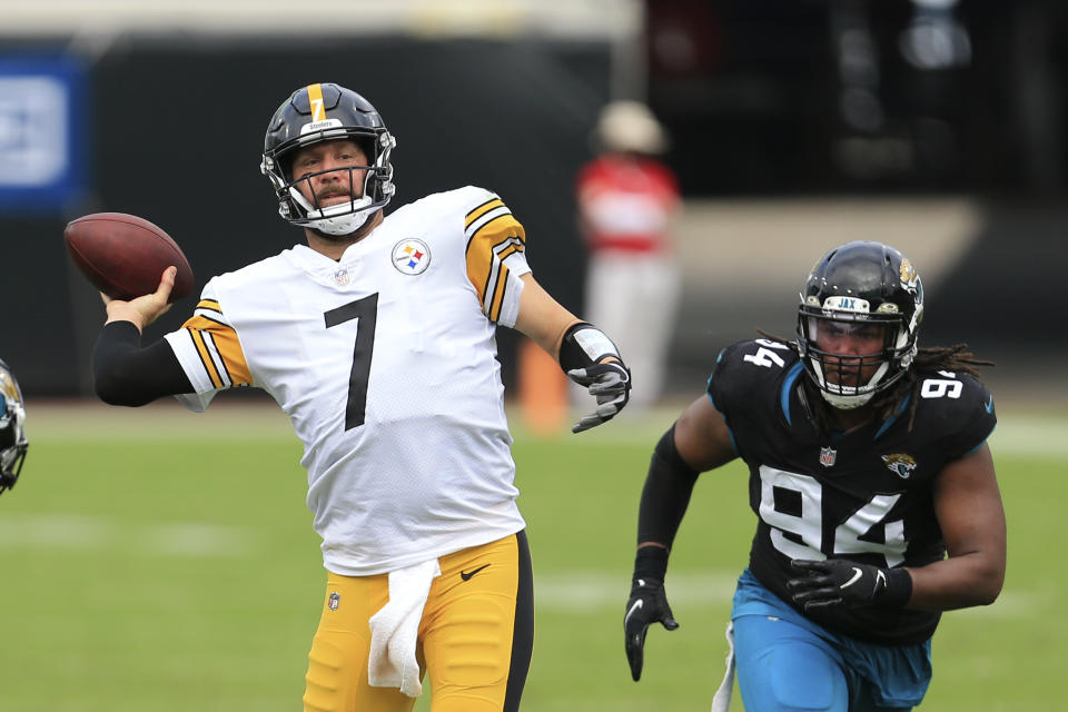 Pittsburgh Steelers quarterback Ben Roethlisberger (7) throws a pass as he gets around Jacksonville Jaguars defensive end Dawuane Smoot (94) during the first half of an NFL football game, Sunday, Nov. 22, 2020, in Jacksonville, Fla. (AP Photo/Matt Stamey)