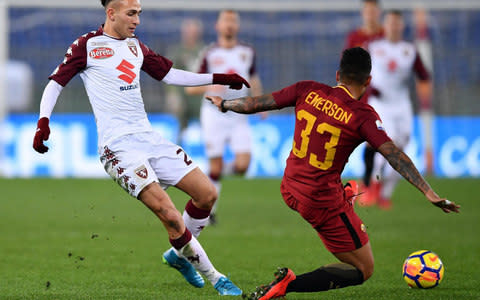 Torino's Simoine Edera, left, vies for the ball with Roma's Emerson Palmieri during an Italian Cup round of 16 soccer match between Roma and Torino - Credit: Ettore Ferrari/ANSA via AP