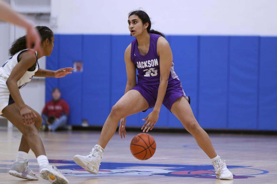 Jackson senior Leena Patibandla with the ball during the Division I district final against Solon, Friday, Feb. 24, 2023, at Ravenna High School.