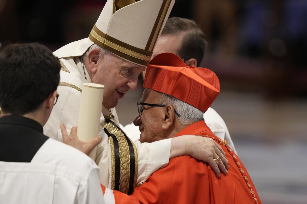 New Cardinal Jorge Enrique Jimenez Carvajal receives the red three-cornered biretta hat from Pope Francis during a consistory inside St. Peter's Basilica, at the Vatican on Saturday.