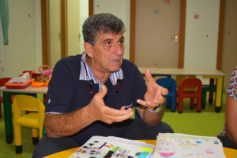 Dr Pietro Bartolo sits in the childrens playroom at the hospital in Lampedusa which has been set up especially for migrant and refugee children