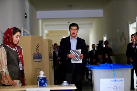 Kurdistan Regional Government Prime Minister Nechirvan Barzani prepares to cast his vote at a polling station during parliamentary elections in the semi-autonomous region in Erbil, Iraq September 30, 2018. REUTERS/Thaier Al-Sudani
