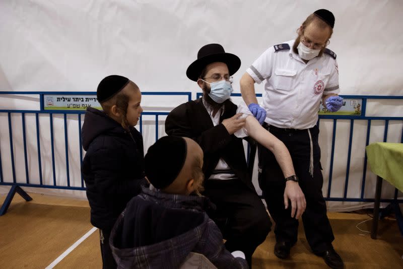 An ultra-Orthodox Jewish man receives a vaccination against the coronavirus disease (COVID-19) at a temporary vaccination centre in the Jewish settlement of Beitar Illit, in the Israeli-occupied West Bank