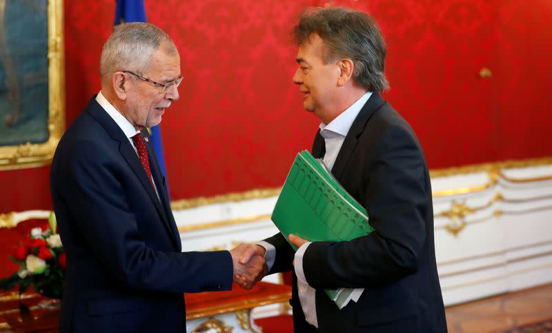 Austria's President Alexander Van der Bellen welcomes head of the Green Party Werner Kogler at the presidential office in Vienna