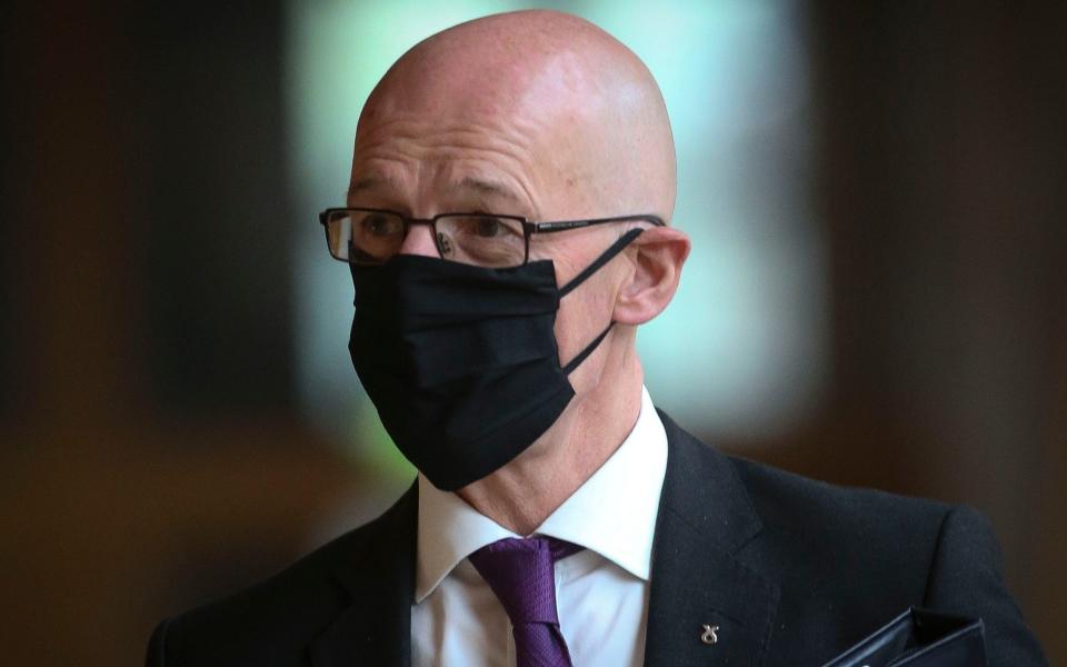 John Swinney walking to the Holyrood chamber - Getty Images Europe