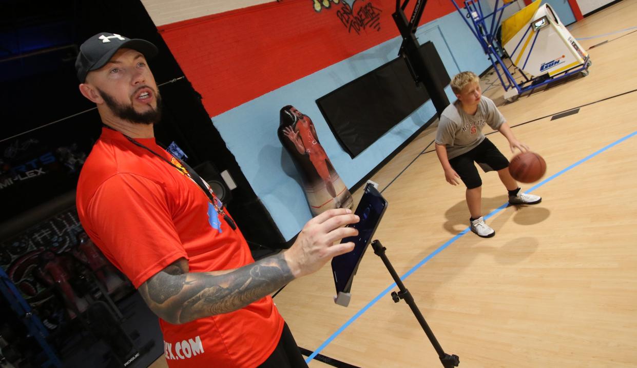 Former Hunter Huss and Tar Heel standout Kris Lang works with kids Thursday morning, Aug. 4, 2022, at Kris Lang Sports Complex on East Catawba Street in Belmont.