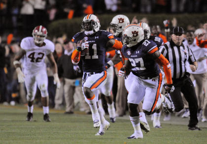 Chris Davis runs the game-winning touchdown back. (USA Today)