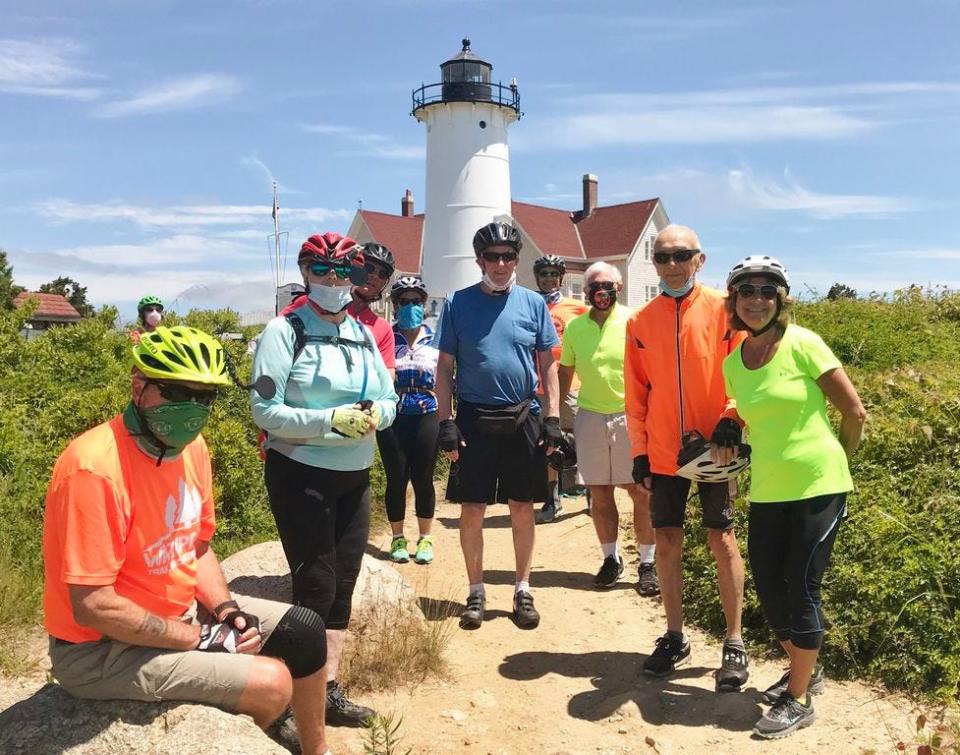 Senior cyclists stop by Nobska Light in Woods Hole to enjoy the views. From left, Rich Carnes, of Middleboro; Claire Bray, of Brockton; Dan Egan, of Plymouth; Debra Gabriele, of Raynham; Rich Quindley, of Hanson; John Goldrosen, of Whitman; Ed Fopiano, of Middleboro; Al Meserve, of Raynham; and Camille Barudin, of Dartmouth.