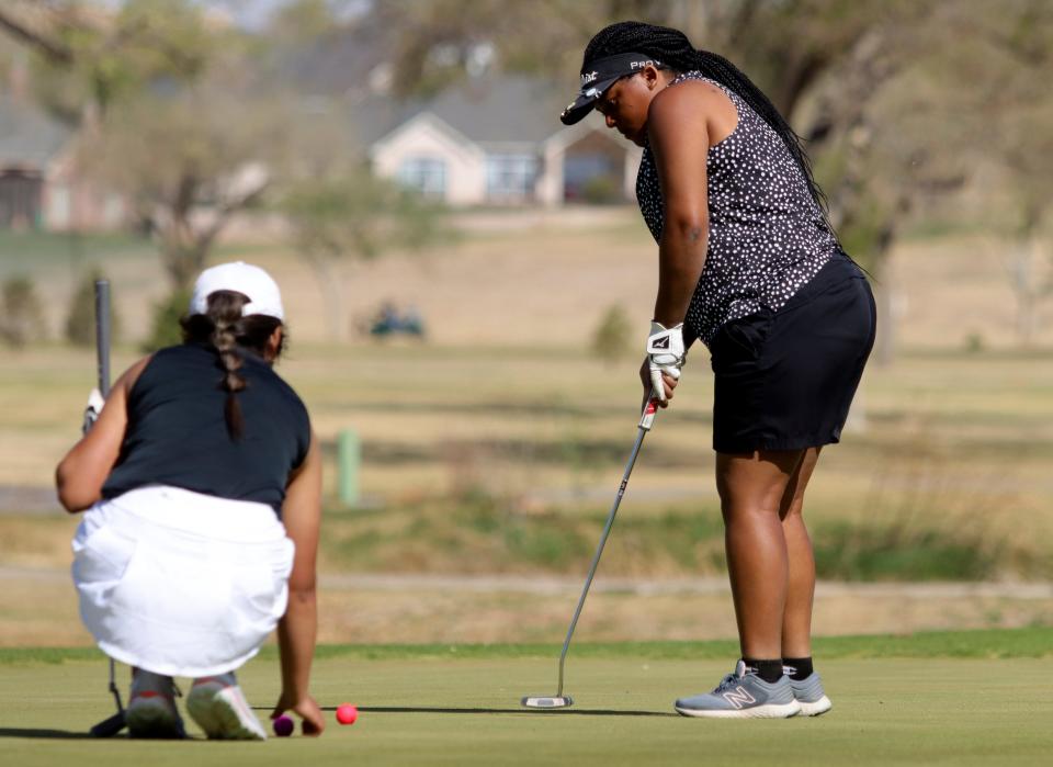 Memphis' Kiyonna Mathews putts on the third hole during the Region 1-2A girls golf tournament, Monday, April 18, 2022, at Palo Duro Creek Golf Course in Canyon.