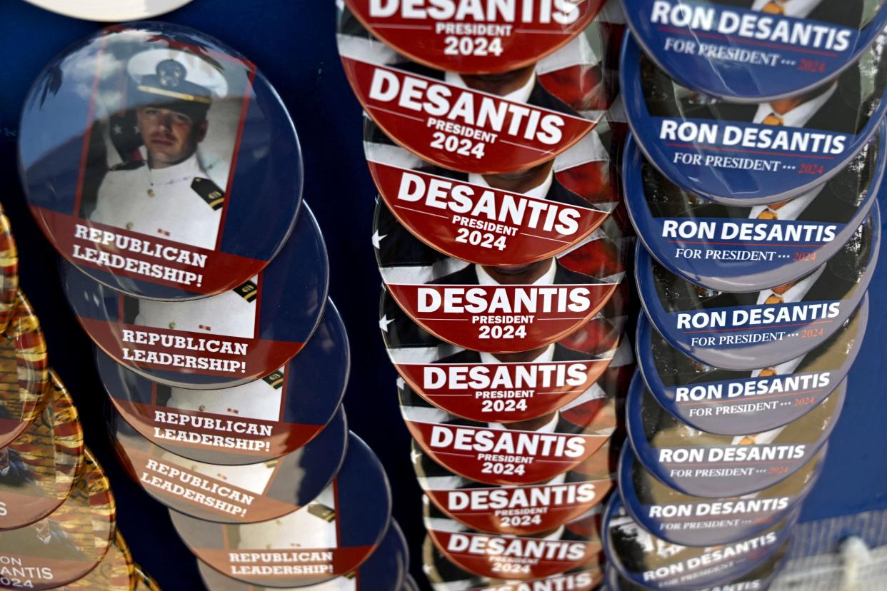 A vendor sells buttons before the start of a campaign event for Republican presidential candidate Ron DeSantis at Eternity Church on May 30, 2023 in Clive, Iowa (AFP via Getty Images)