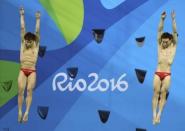 2016 Rio Olympics - Diving - Final - Men's Synchronised 3m Springboard - Maria Lenk Aquatics Centre - Rio de Janeiro, Brazil - 10/08/2016. Cao Yuan (CHN) and Qin Kai (CHN) of China compete. REUTERS/Antonio Bronic