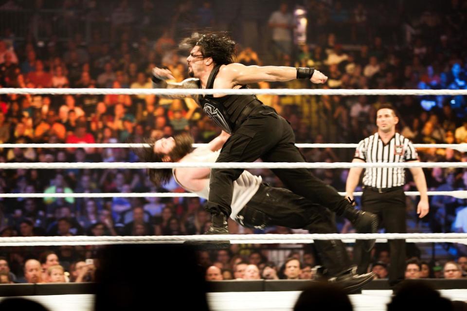 Roman Reigns on the attack at the WWE SummerSlam 2015 (Getty Images)