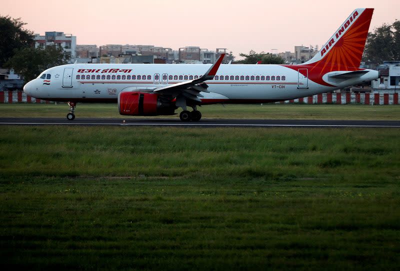 FILE PHOTO: An Air India Airbus A320neo passenger plane moves on the runway after landing, in Ahmedabad