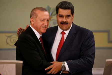 Turkish President Tayyip Erdogan and Venezuela's President Nicolas Maduro attend a news conference after an agreement-signing ceremony between Turkey and Venezuela at Miraflores Palace in Caracas, Venezuela December 3, 2018. REUTERS/Manaure Quintero