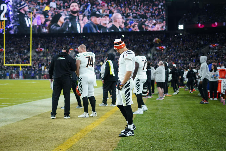 Cincinnati Bengals quarterback Joe Burrow (9) looks down on the sideline in the second half of an NFL football game against the Baltimore Ravens in Baltimore, Thursday, Nov. 16, 2023. (AP Photo/Matt Rourke)