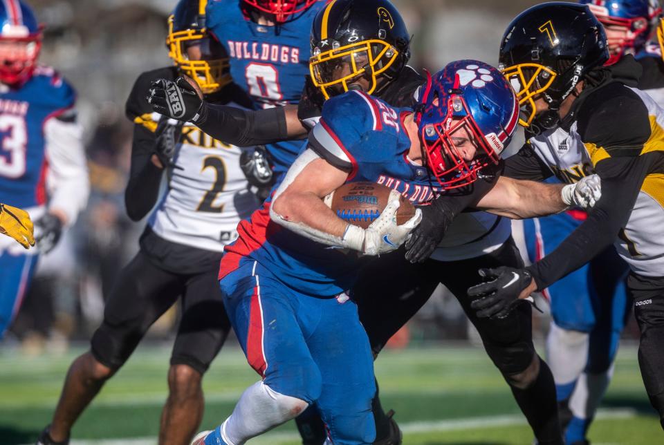 Mason's running back AJ Martel runs the ball against Detroit King during the second half at Chelsea High School on Saturday, Nov. 18, 2023.