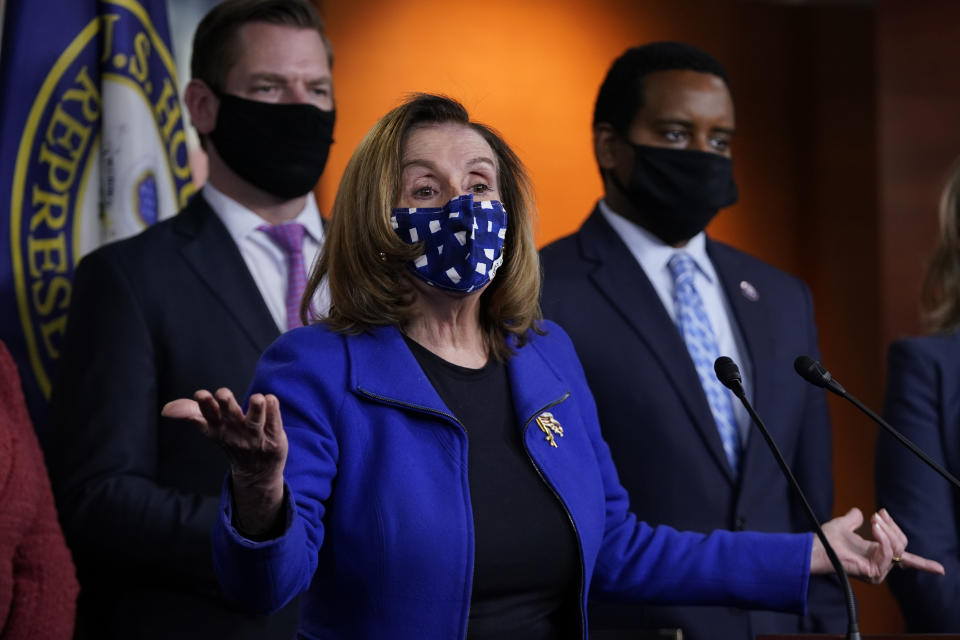 House Speaker Nancy Pelosi of Calif., with impeachment managers Rep. Eric Swalwell, D-Calif., and Rep. Joe Neguse, D-Colo., speaks to members of the media during a news conference on Capitol Hill in Washington, after the U.S. Senate voted not guilty, to acquit former President Donald Trump of inciting riot at U.S. Capitol, ending impeachment trial, Saturday, Feb. 13, 2021. (AP Photo/Manuel Balce Ceneta)