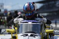 Colton Herta climbs out of his car following a practice session for the IndyCar Grand Prix auto race at Indianapolis Motor Speedway, Saturday, May 11, 2024, in Indianapolis. (AP Photo/Darron Cummings)