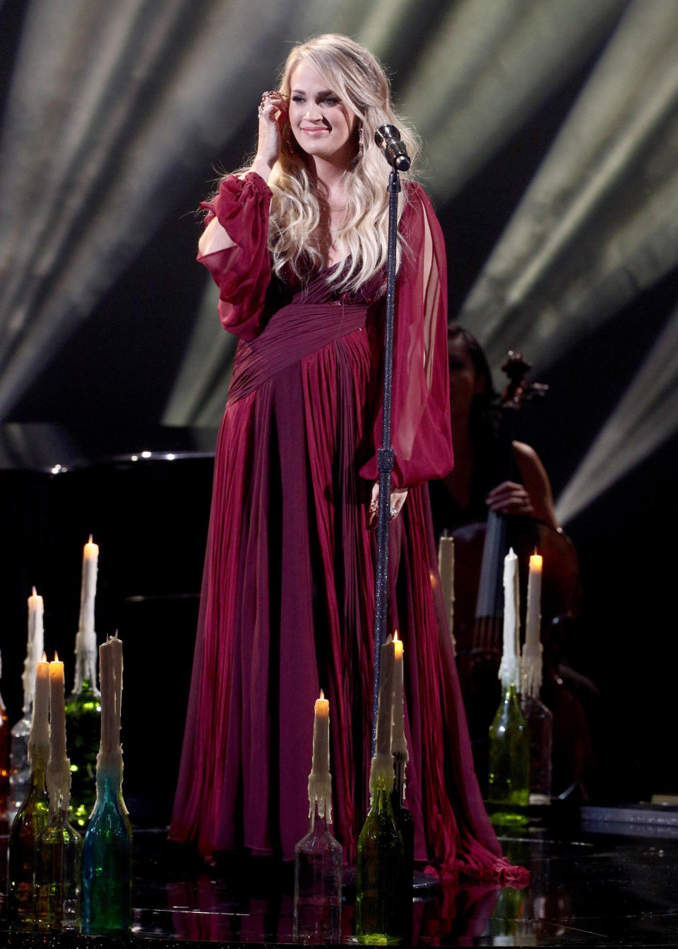 The country singer changed into a long, flowing red gown for the performance.&nbsp; (Photo: Frederick M. Brown via Getty Images)