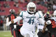 Coastal Carolina's Myles Olufemi (41) reacts after making a tackle against Arkansas State during the first half of an NCAA college football game Thursday, Oct. 7, 2021, in Jonesboro, Ark. (AP Photo/Michael Woods)