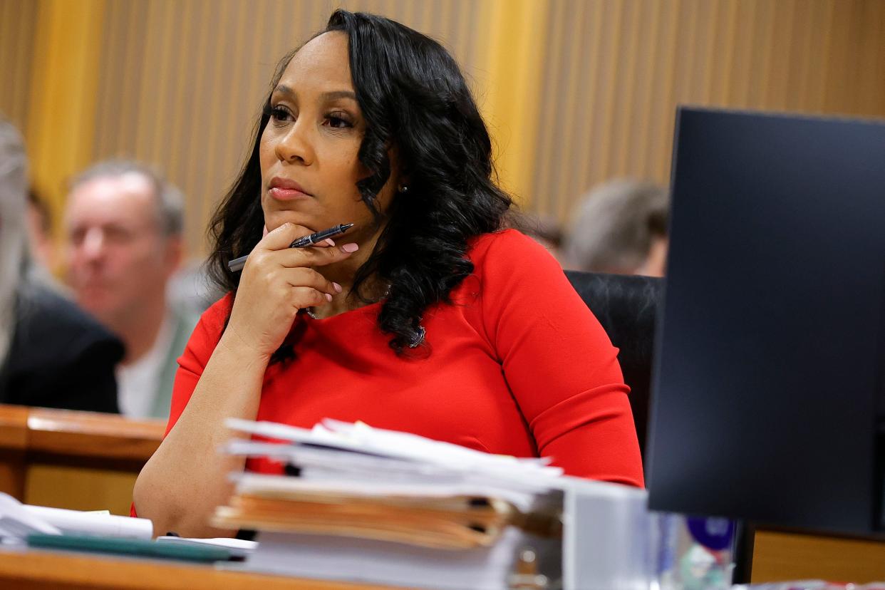 Fulton County District Attorney Fani Willis looks on during a hearing on the Georgia election interference case, Friday, March, 1, 2024, in Atlanta. A progressive Democrat and a Republican who briefly worked in Donald Trump's administration entered the Fulton County district attorney's race Friday, March 8, 2024, as the current officeholder, Willis, awaits a judge's decision on whether she will be removed from the Georgia election interference case against the former president. (AP Photo/Alex Slitz, Pool, File) ORG XMIT: NYDD204