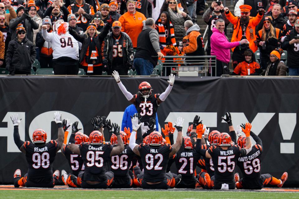 The Cincinnati Bengals defenses lead by cornerback Tre Flowers (33) celebrates an interception against the Baltimore Ravens in the first half of an NFL football game in Cincinnati, Sunday, Jan. 8, 2023. (AP Photo/Jeff Dean)