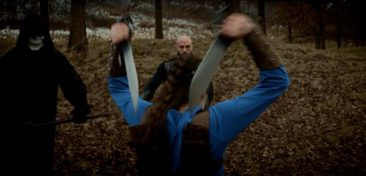 A knife-wielding Lydia Zagorski in a fight scene from one of her earlier films.