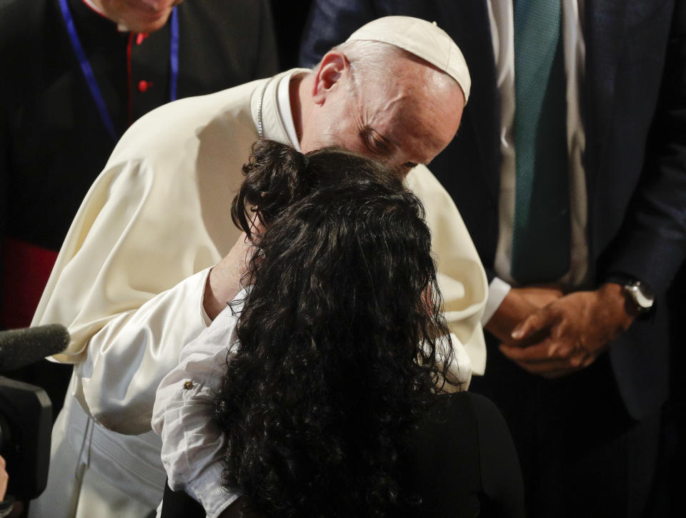 Pope Francis kisses a young girl at the end of his meeting with Irish Prime Minister Leo Varadkar, in Dublin, Ireland, Saturday, Aug. 25, 2018. Pope Francis is on a two-day visit to Ireland. (AP Photo/Gregorio Borgia)