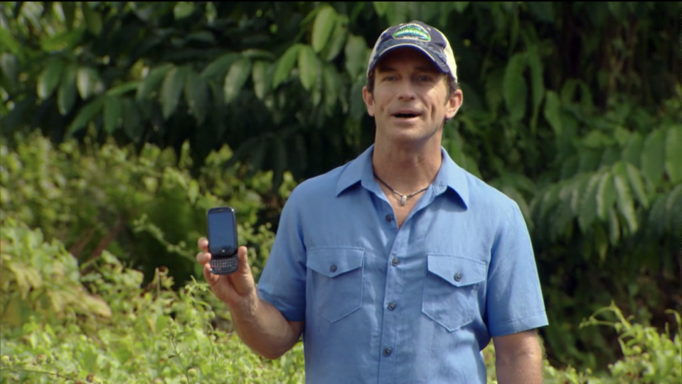 Jeff Probst holds a Sprint cell phone