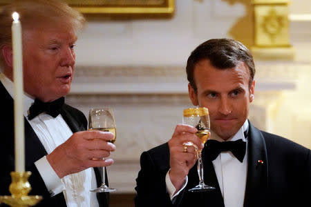 French President Emmanuel Macron toasts U.S. President Donald Trump during a State Dinner at the White House in Washington, U.S. April 24, 2018. REUTERS/Carlos Barria