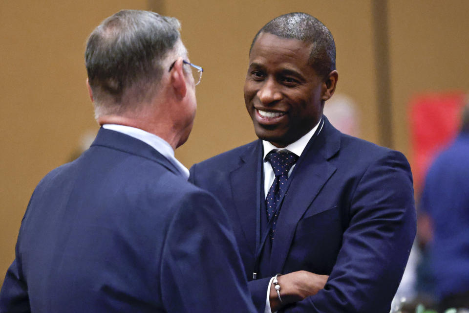 Bennie Smith, commissioner from Shelby County (TN) speaks with Arizona Representative Mark Finchem before an Election Conspiracy Forum event hosted by Tennessee Stands Saturday, March 11, 2023, in Franklin, Tenn. (AP Photo/Wade Payne)