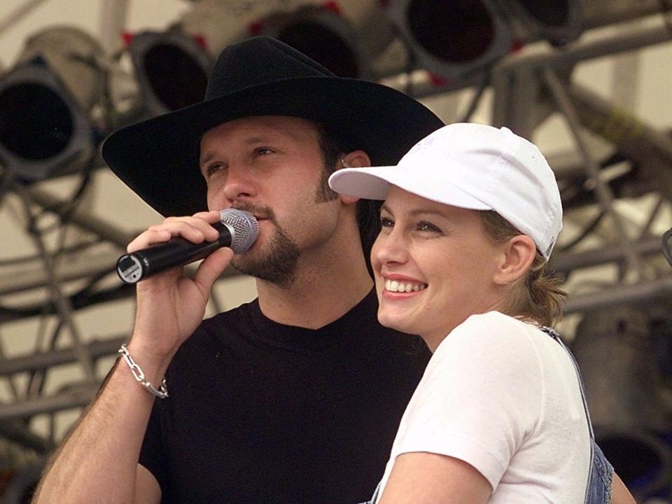 Tim McGraw and his wife, Faith Hill, perform together at the Internatonal Country Music Fan Fair