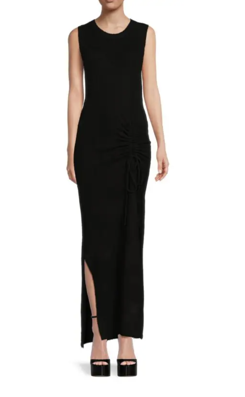 model in black platform sandals and black Line & Dot Anna Ruched Front Sheath Maxi Sweater Dress (Photo via Saks Off Fifth)