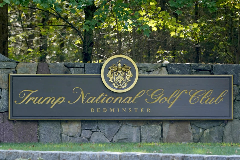 A sign is seen at the entrance to Trump National Golf Club in Bedminster, N.J., Friday, Oct. 2, 2020. With just a month to go until the election, President Donald Trump had a busy schedule in the week before the coronavirus hit home with him. Trump tweeted early Friday that he and first lady Melania Trump had tested positive for the coronavirus. (AP Photo/Seth Wenig)