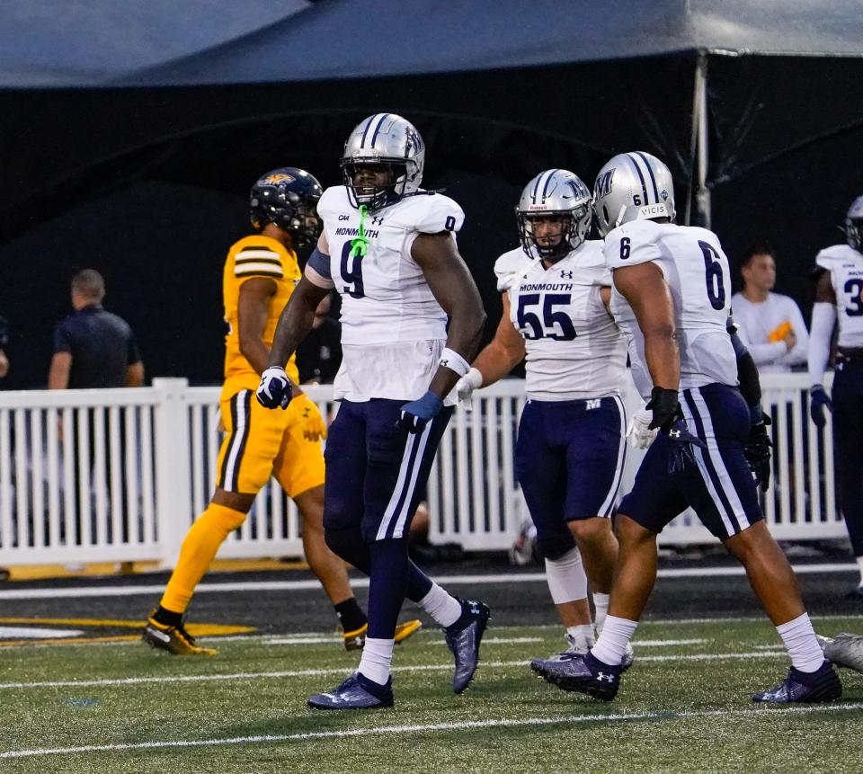 Monmouth defensive end Nick White (9) and linebackers Ryan Moran (55) and Jake Brown (6) come off the field after a stop against Towson on Sept. 9, 2023 in Towson, Maryland.