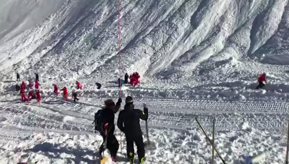 In this image taken from video, rescue personnel work at the site of an avalanche at Lavachet Wall in Tignes, France, Monday Feb. 13, 2017. French rescue workers say a number of skiers have been killed in an avalanche in the French Alps near the resort of Tignes. It occurred in an area popular among international skiers for its extensive slopes and stunning views, but no information was immediately available about the skiers' nationalities. (AP Photo)