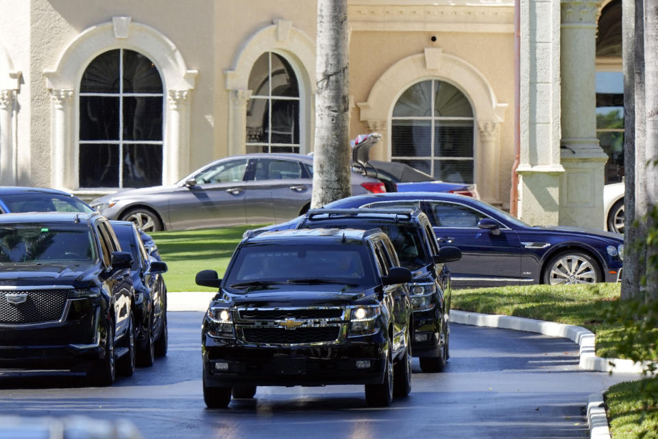 The motorcade of former President Donald Trump leaves his Trump International Golf Club in West Palm Beach, Fla., Thursday, March 23, 2023. (AP Photo/Gerald Herbert)