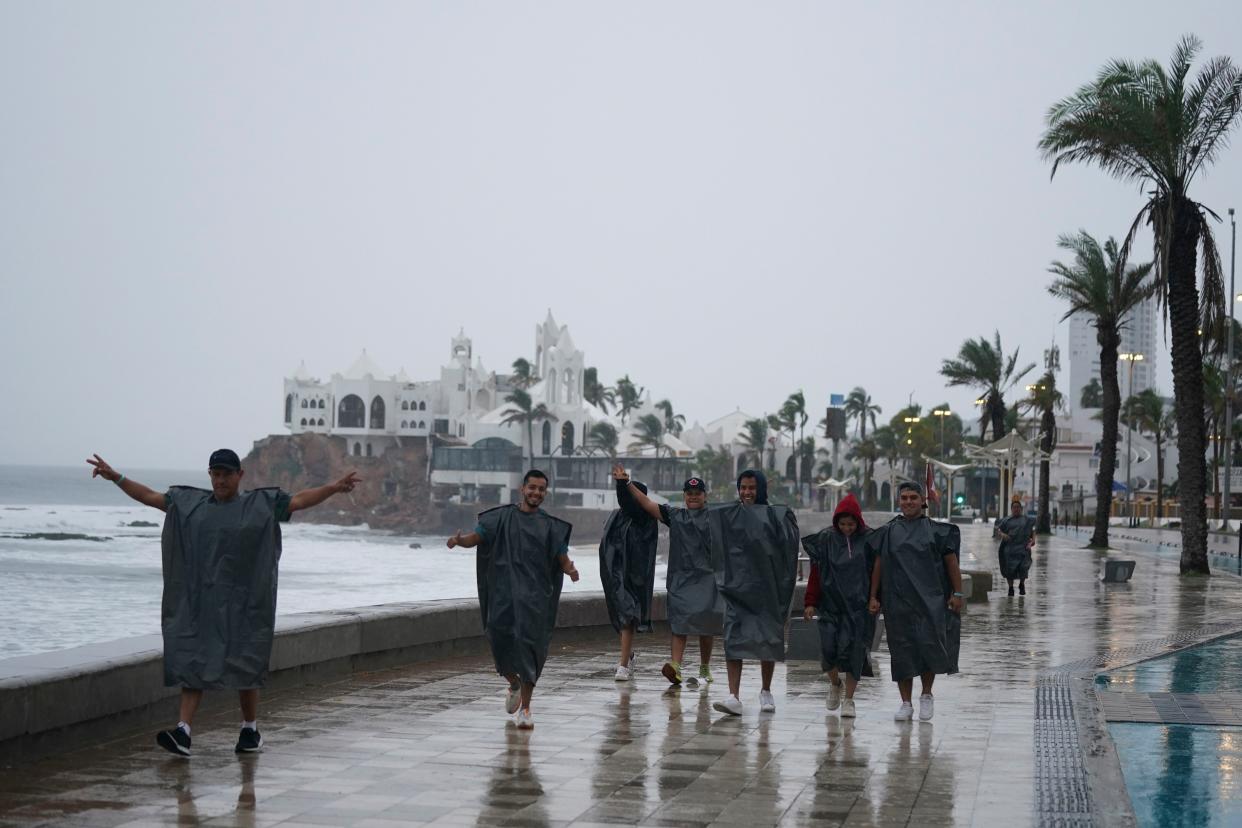 Tourists from Culiacan, Mexico in Mazatlan, Mexico, early Monday.