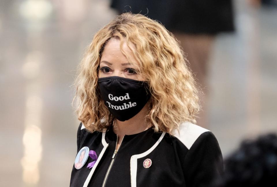 <p>Representative Lucy McBath (D-GA) entered the memorial service. Many attendees, McBath included, chose to wear face masks reading "Good Trouble," a term coined by Lewis himself. </p>