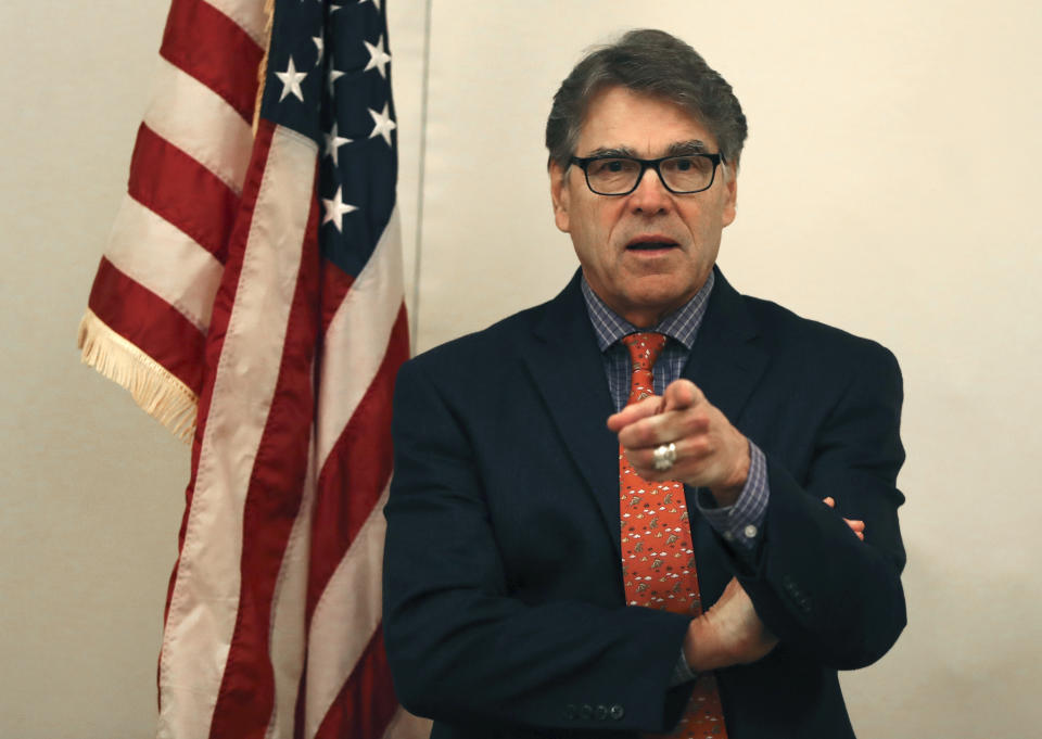 The outgoing U.S. Energy Secretary Rick Perry talks to the journalists during a roundtable presser in Dubai, United Arab Emirates, Saturday, Oct. 26, 2019. (AP Photo/Kamran Jebreili)